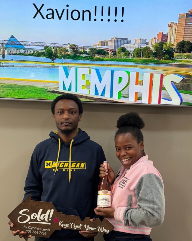 Happy clients and Realtors celebrating closing day at Sure Title Company, Memphis
