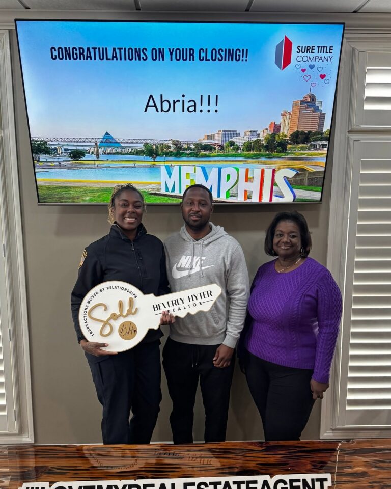 Happy clients and Realtors celebrating closing day at Sure Title Company, Memphis