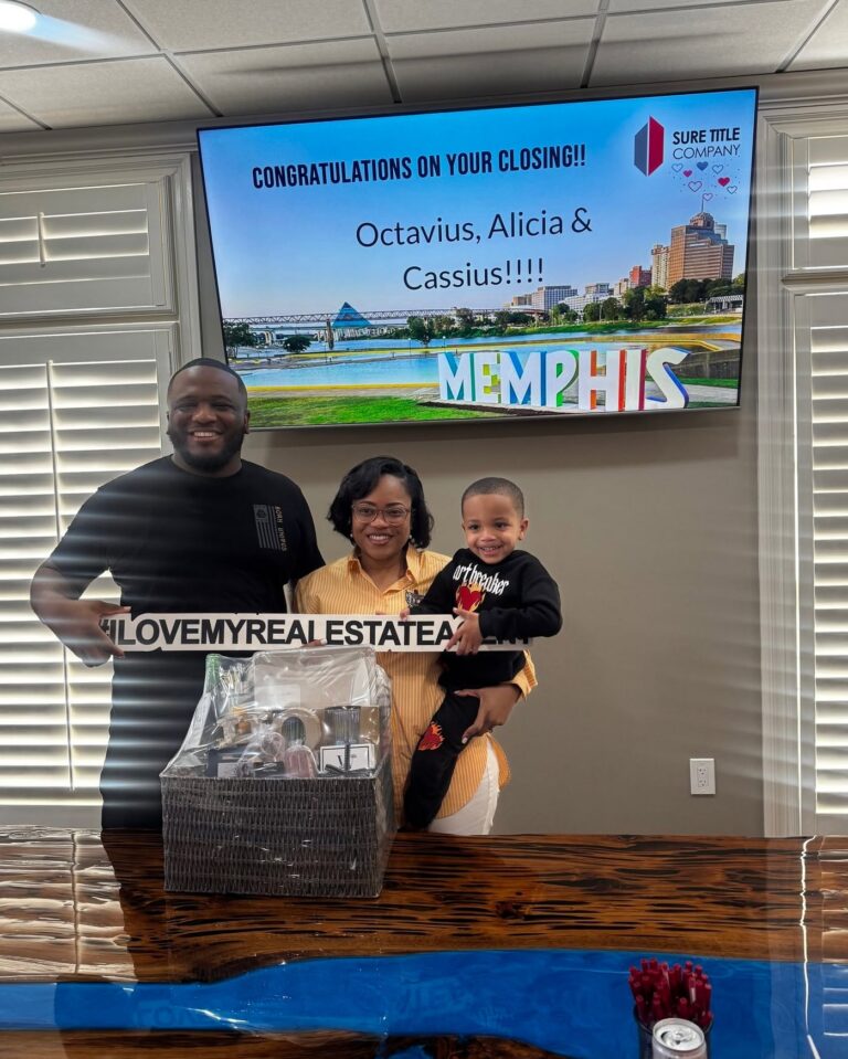 Happy clients and Realtors celebrating closing day at Sure Title Company, Memphis