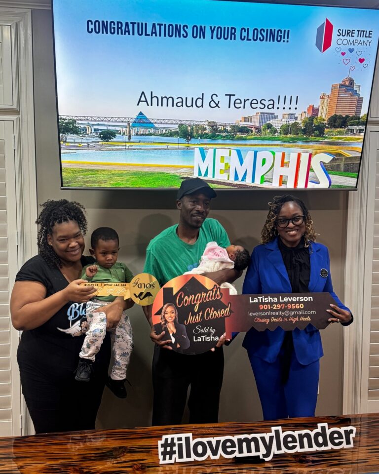 Happy clients and Realtors celebrating closing day at Sure Title Company, Memphis